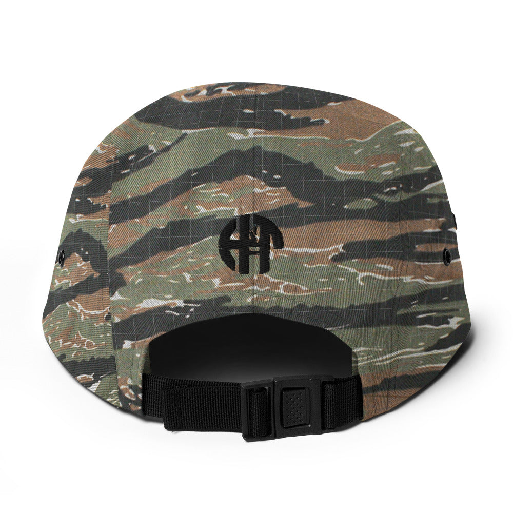 Classic HFT five-panel cap featuring a low profile fit, a nylon strap clip closure at the back with an adjustable strap, and a subtle HFT logo on the rear, set against a plain backdrop for a clean presentation tiger camo back