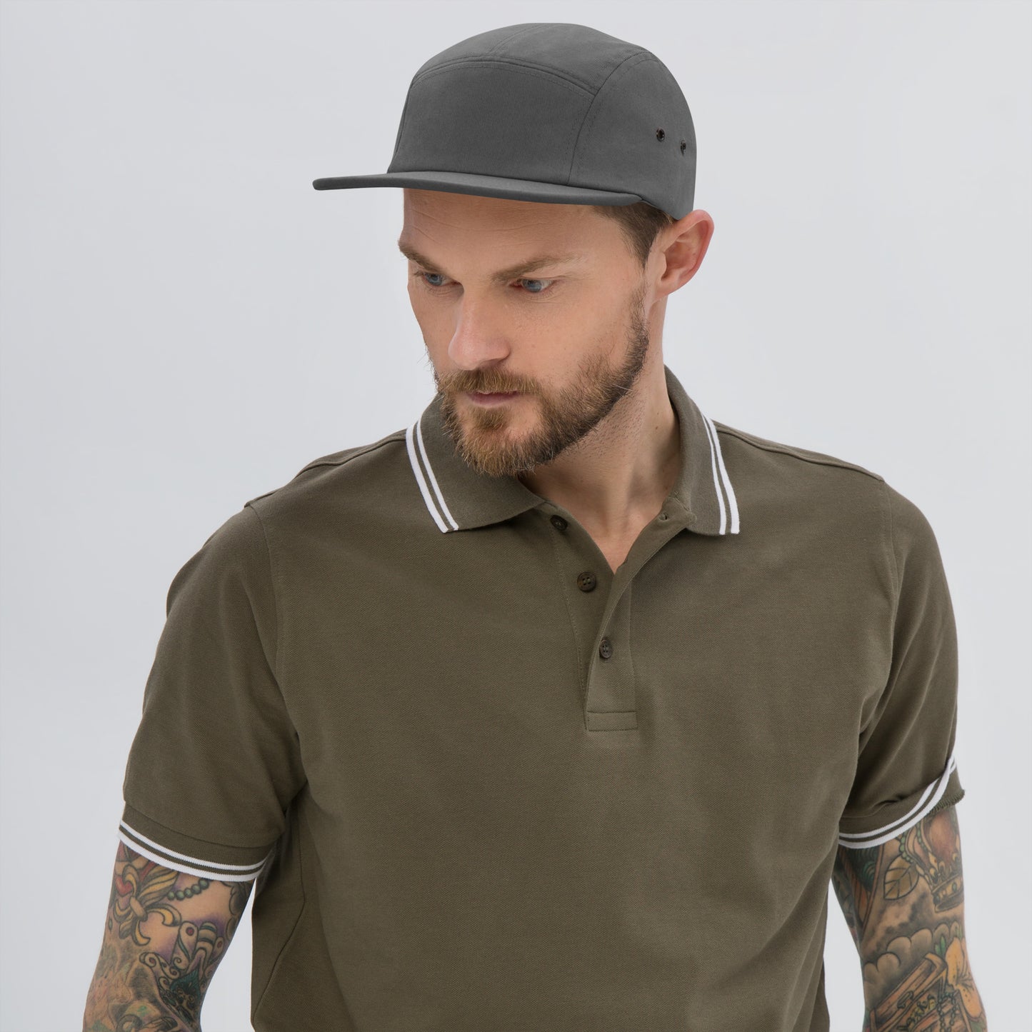 Classic HFT five-panel cap featuring a low profile fit, a nylon strap clip closure at the back with an adjustable strap, and a subtle HFT logo on the rear, set against a plain backdrop for a clean presentation grey front