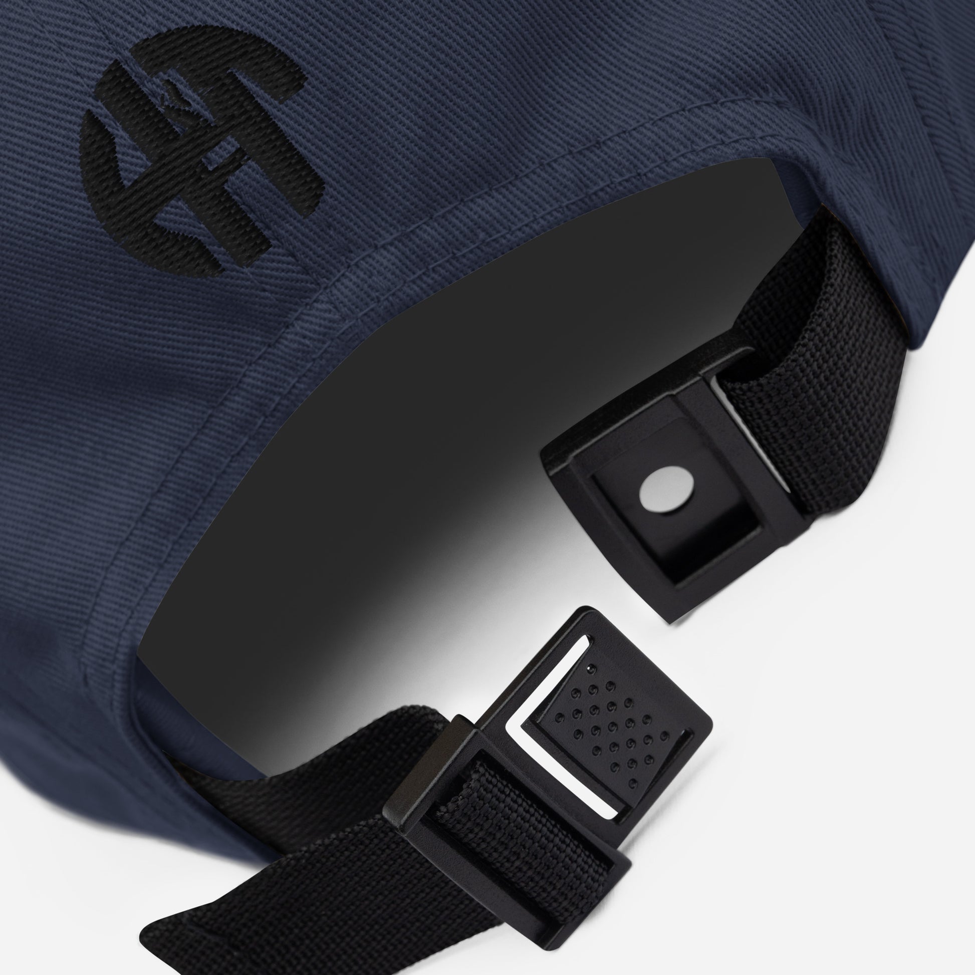 Classic HFT five-panel cap featuring a low profile fit, a nylon strap clip closure at the back with an adjustable strap, and a subtle HFT logo on the rear, set against a plain backdrop for a clean presentation details