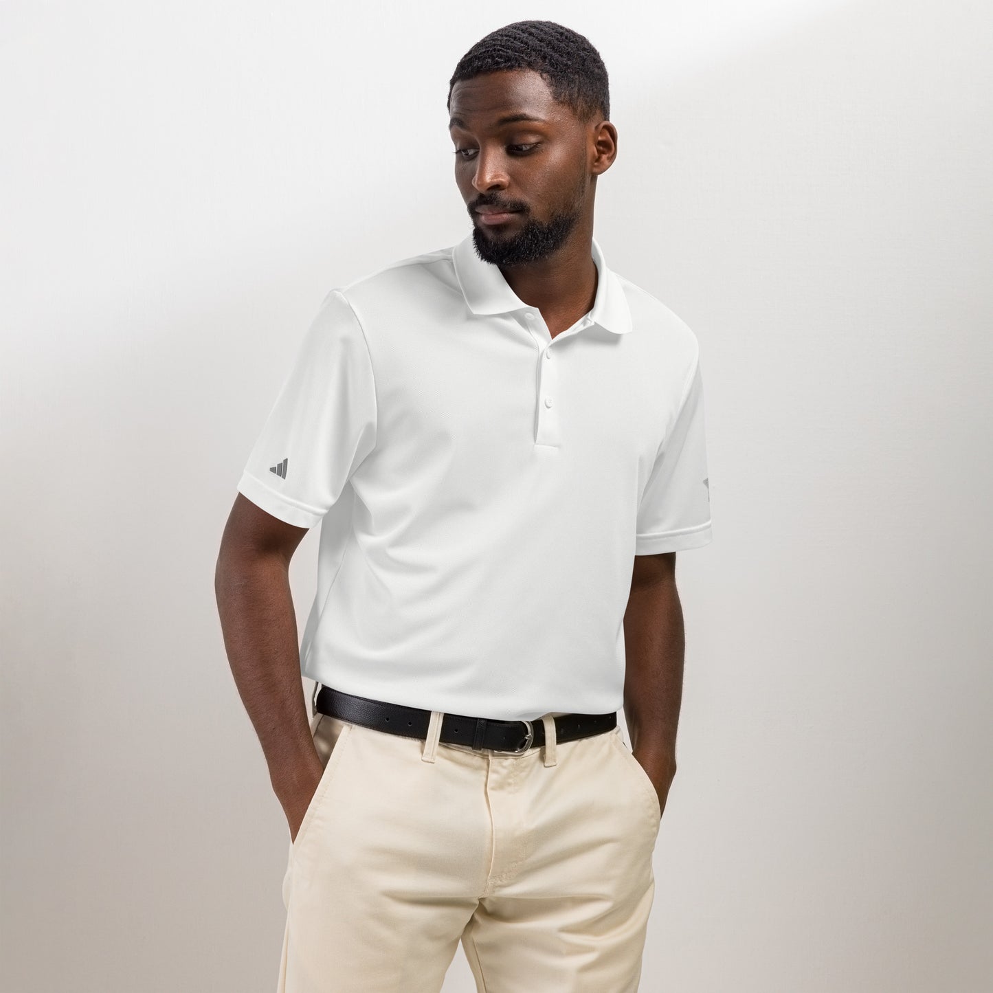 Classic navy Adidas sport polo shirt crafted from 100% recycled polyester piqué, with a sleek hydrophilic finish for cooler comfort and an athletic fit suited for sports and leisure white 