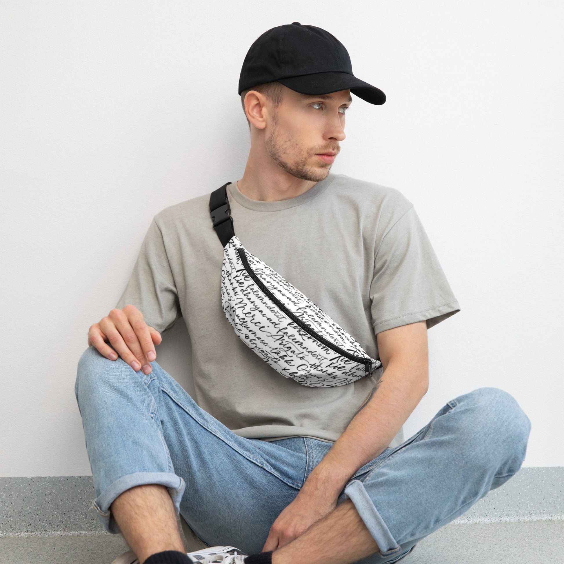 Stylish HFT Fanny Pack with adjustable black straps and a multilingual 'thank you' script pattern in a handwritten font on a white background, featuring a zippered compartment and a compact design front