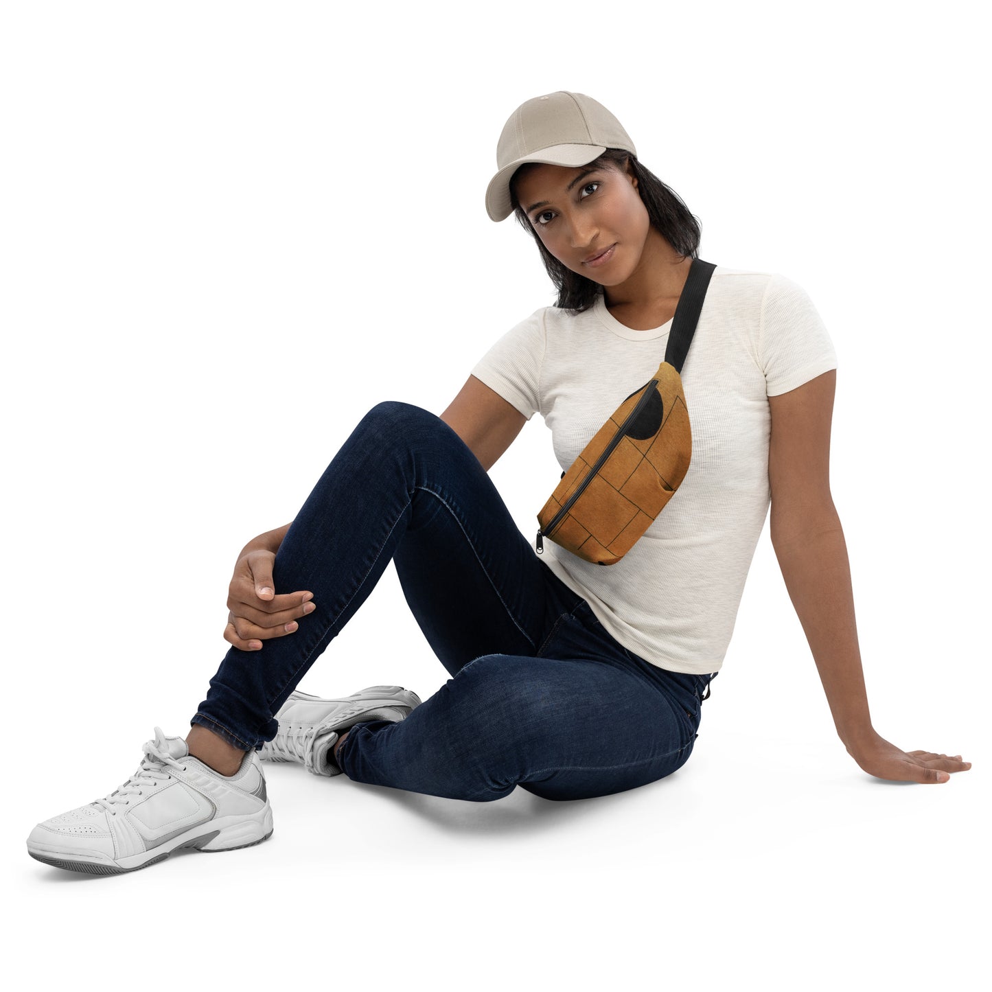 Stylish HFT Fanny Pack III in camel brown with a black abstract design, featuring a large zippered compartment and a durable, adjustable black strap, against a clear background front female sitting