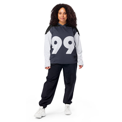 Hockey jersey featuring a large number 99 on the front in white with a unique quilted design texture on the shoulders and sleeves, against a navy backdrop with a v-neck collar and black upper chest panel female