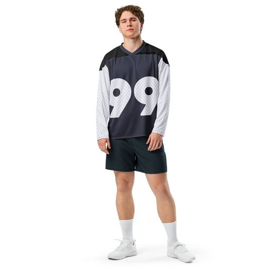 Hockey jersey featuring a large number 99 on the front in white with a unique quilted design texture on the shoulders and sleeves, against a navy backdrop with a v-neck collar and black upper chest panel male