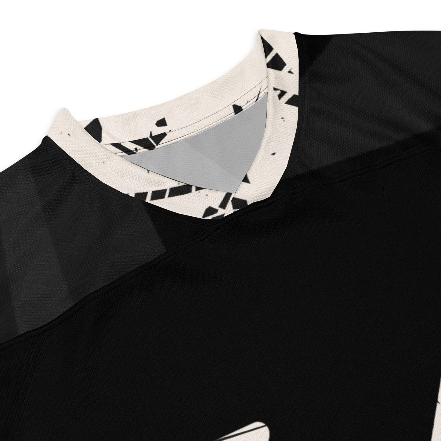 A stylized black hockey jersey with a bold, graphic design featuring the number 66 in large, white, distressed font prominently displayed on the front. The sleeves and shoulders are adorned with abstract black and white patterns, adding a modern touch to the athletic wear neck