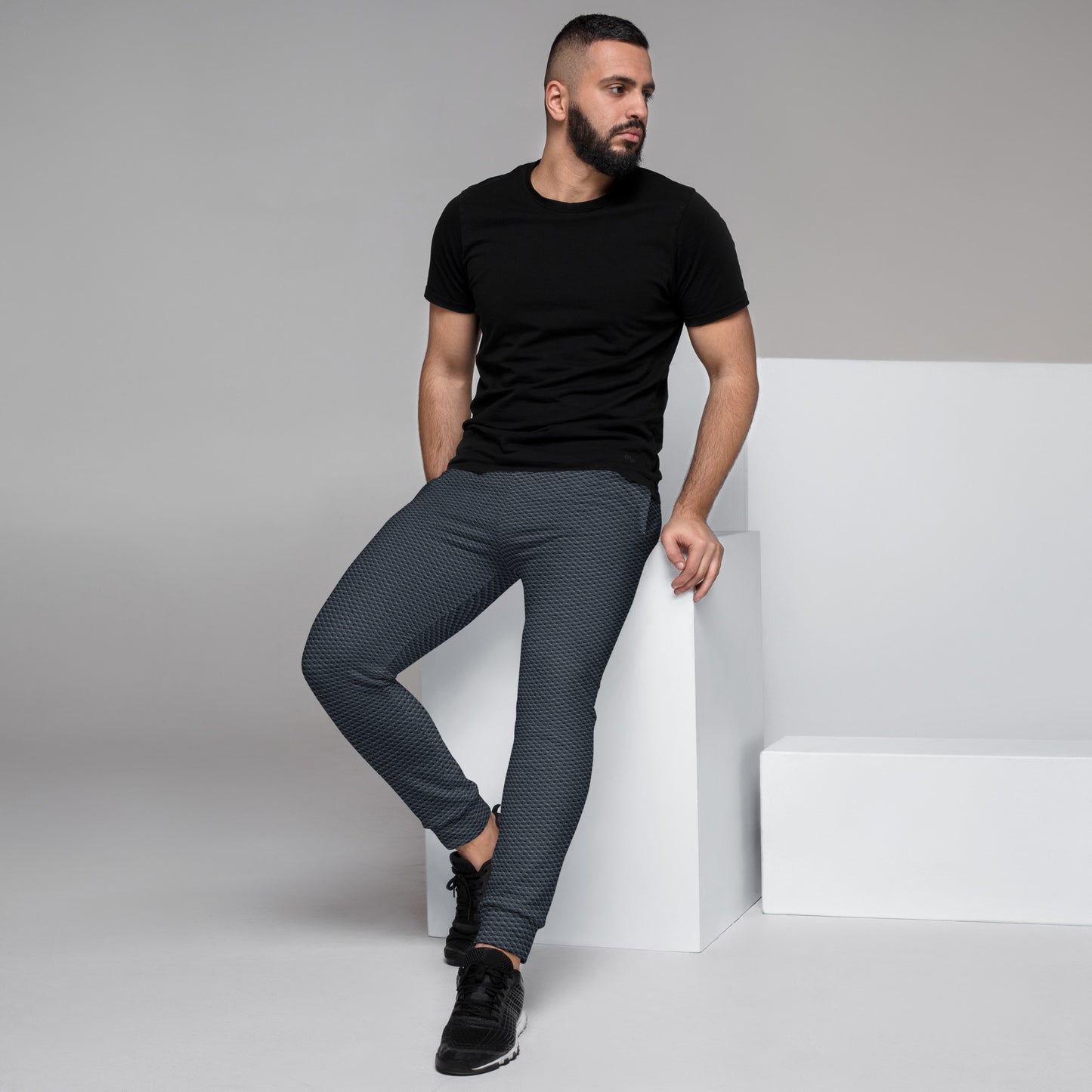 HFT Men's Joggers III, featuring a textured fabric design in a dark color, with a comfortable and stretchable waistband and cuffs, ideal for both athletic activities and leisure left