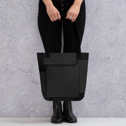 woman hold HFT Tote Bag featuring a sleek black design with spacious compartments, suitable for carrying a variety of items