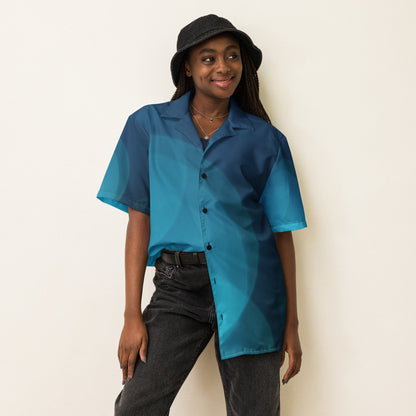 The HFT Unisex Button Shirt I in gradient shades of blue, designed with short sleeves and a sleek button-up front, made from lightweight, moisture-wicking fabric for ultimate summer comfort female