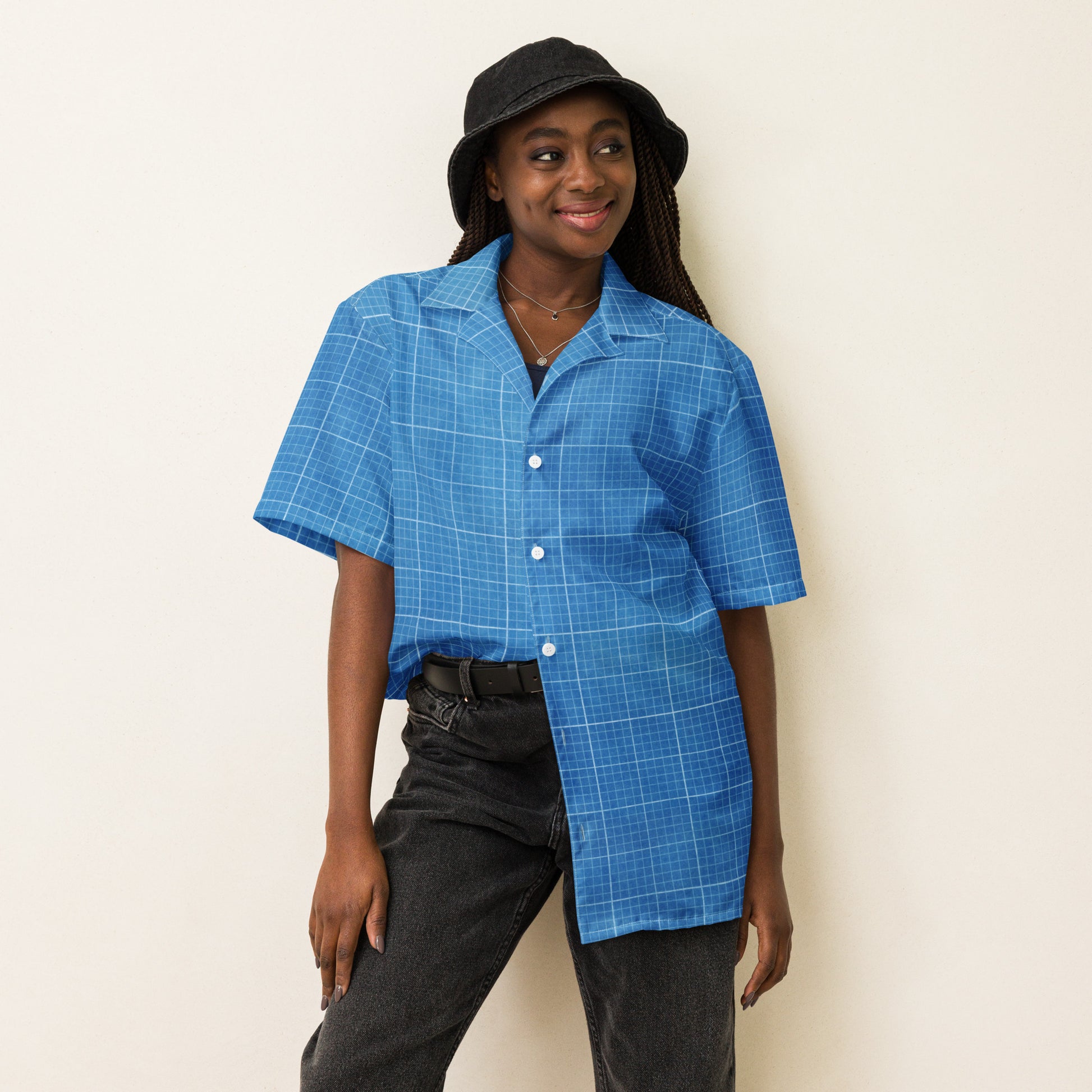 Light blue unisex button-down shirt featuring a subtle grid pattern and a classic collar, tailored for a versatile fit front