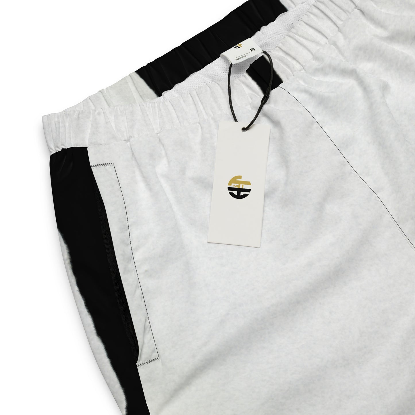 Pair of HFT Unisex Track Pants IV in a crisp white color with contrasting black side stripes, elastic waistband, and cuffs, laid flat on a white background detail