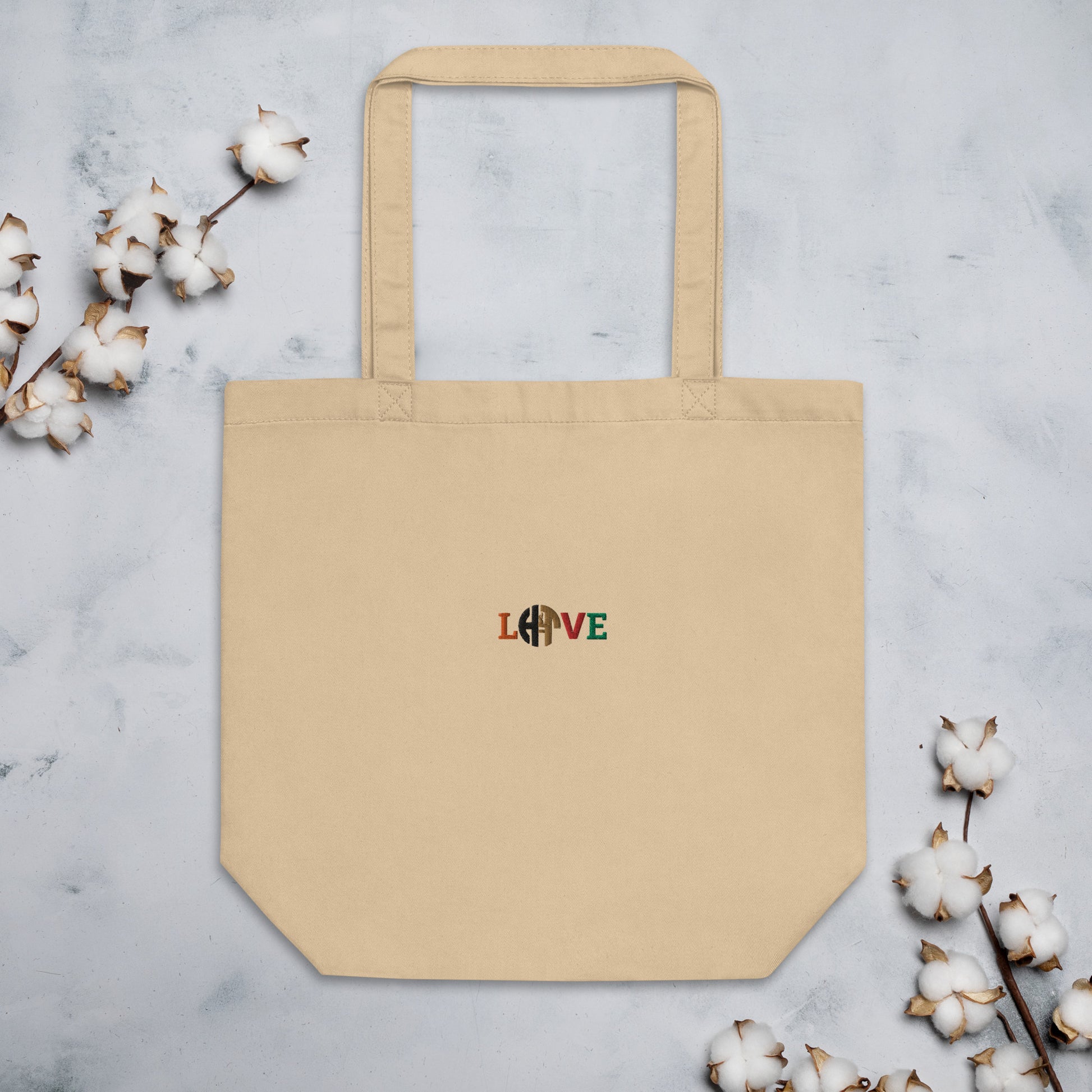 Eco-friendly unisex beige organic cotton tote bag with HFT logo styled as 'LOVE' printed on the front, showcasing ample space, perfect for carrying groceries or books. front