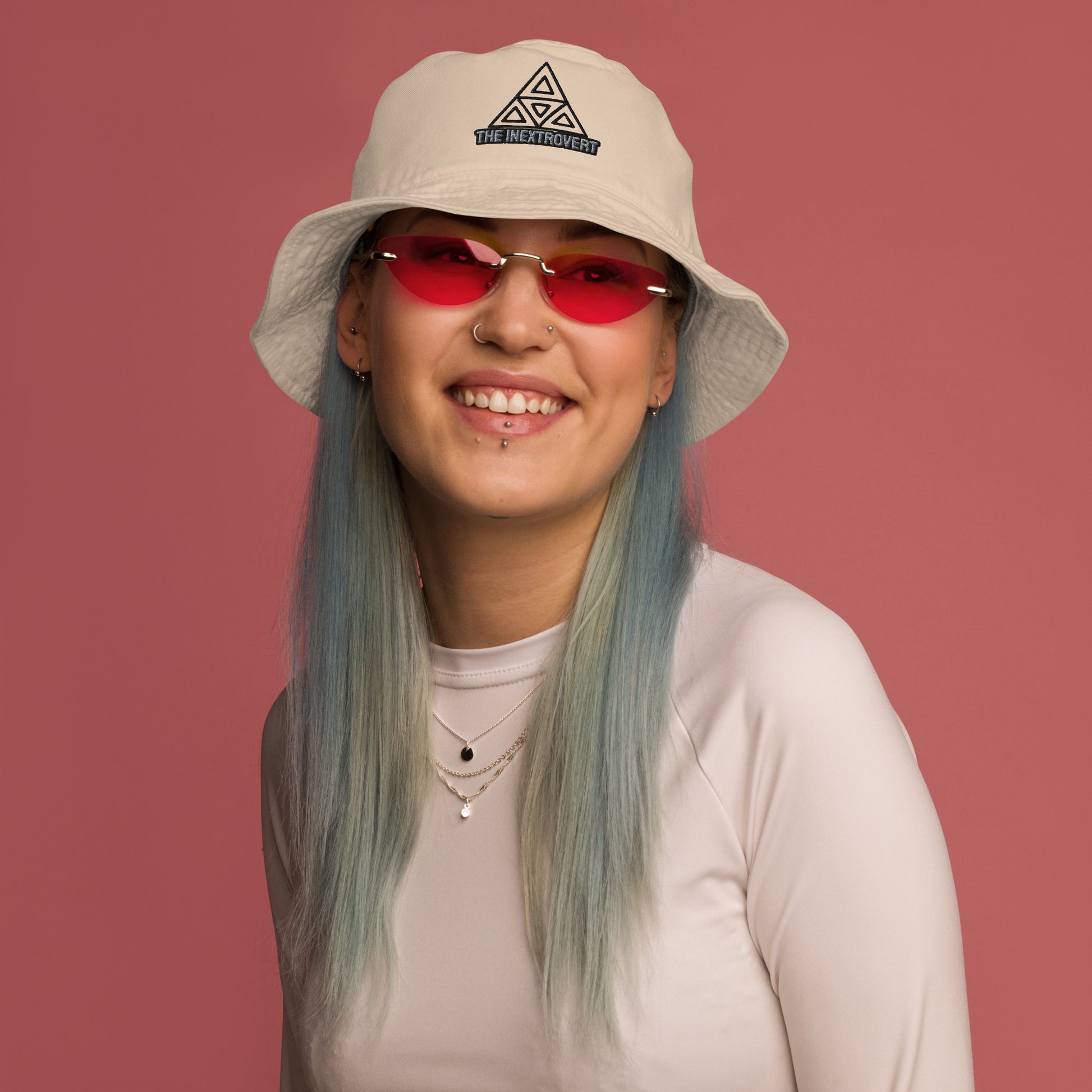 The Inextrovert Organic Bucket Hat made of 100% cotton twill with a boldtriangle logo, showcasing a minimalist and breathable design, casting a soft shadow on a bright surface STONE FRONT