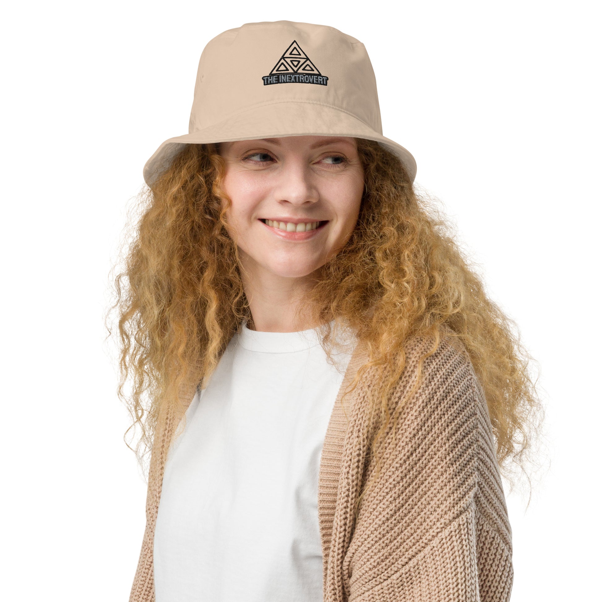 The Inextrovert Organic Bucket Hat made of 100% cotton twill with a boldtriangle logo, showcasing a minimalist and breathable design, casting a soft shadow on a bright surface stone front