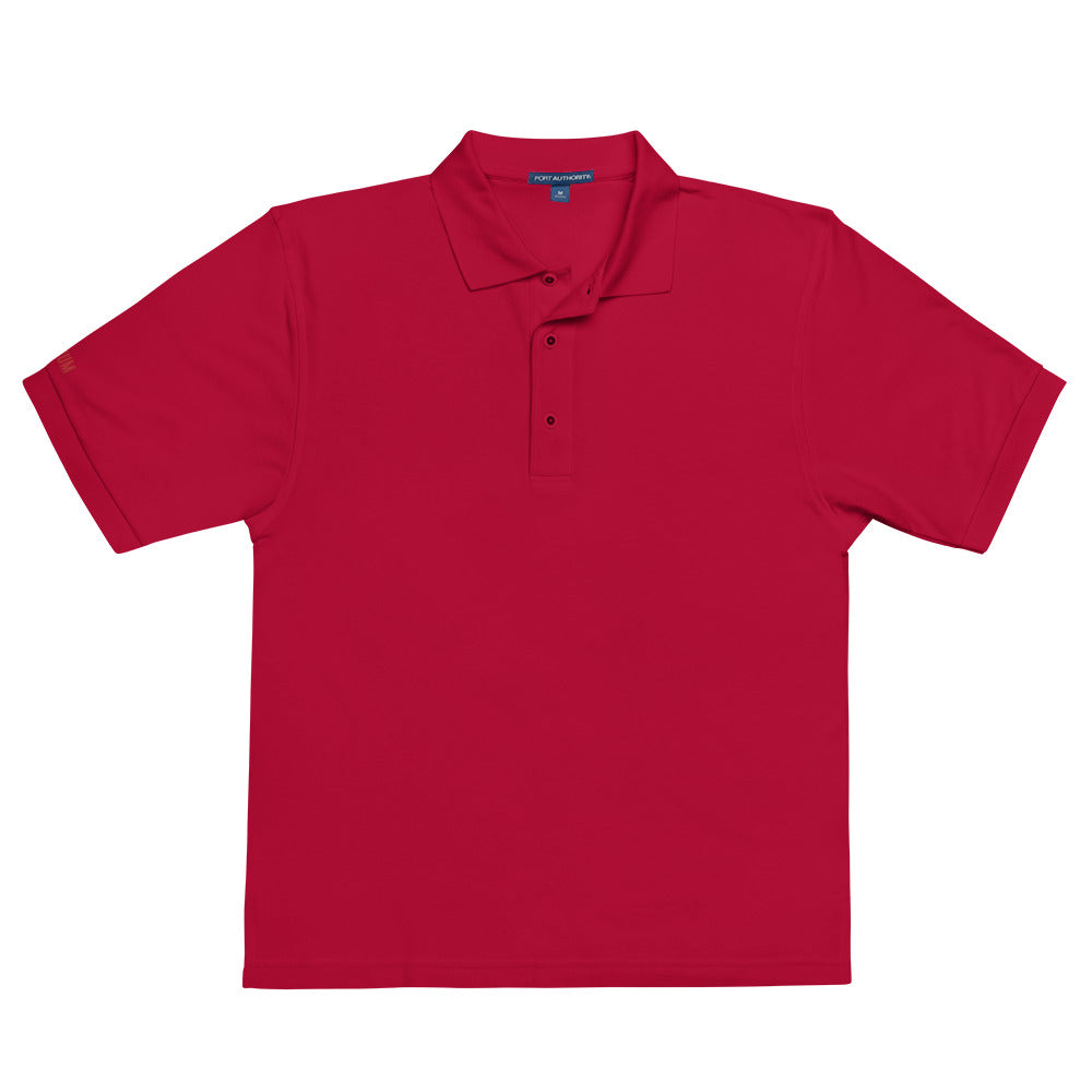 Port Authority Men's Premium Polo shirt in a relaxed fit, featuring a flat knit collar, metal buttons, and HFT store embroidery red front male model