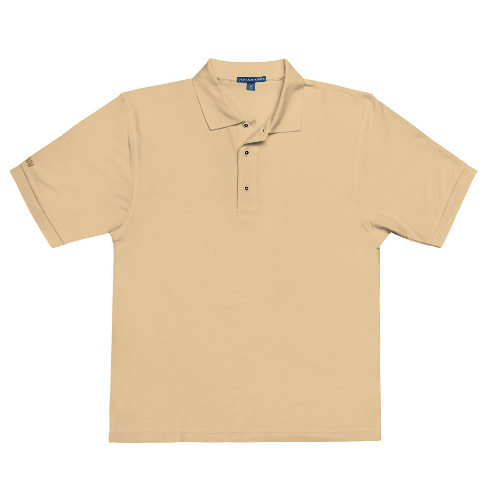 Port Authority Men's Premium Polo shirt in a relaxed fit, featuring a flat knit collar, metal buttons, and HFT store embroidery. Shown in a classic stone front