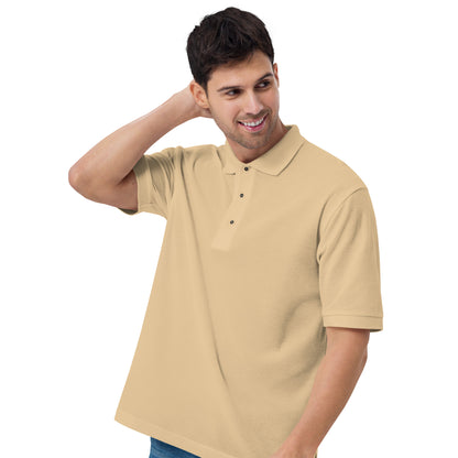 Port Authority Men's Premium Polo shirt in a relaxed fit, featuring a flat knit collar, metal buttons, and HFT store embroidery. Shown in a classic stone front male model stand