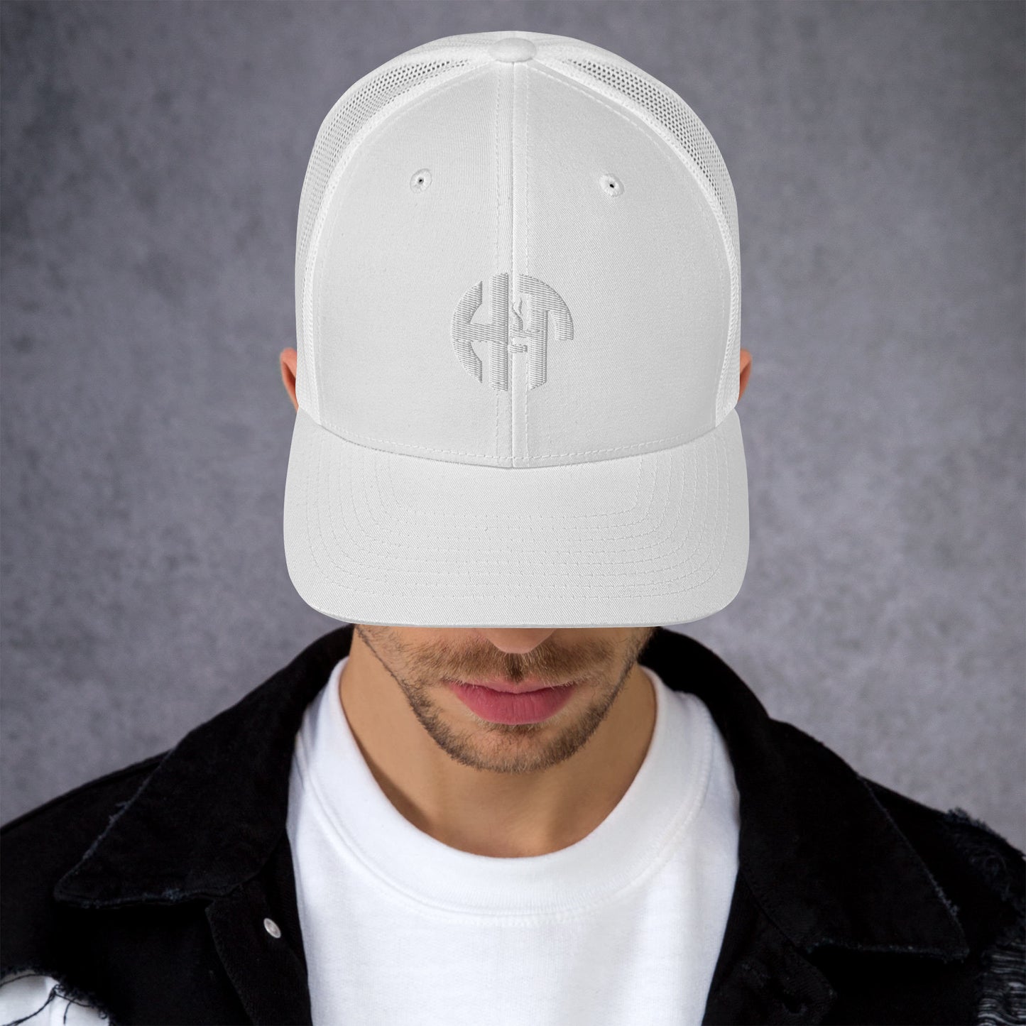 A stylish six-panel trucker cap with a breathable mesh back and a front panel featuring a black 'HFT' logo, complete with a pre-curved brim and an adjustable snap closure for comfort whilte