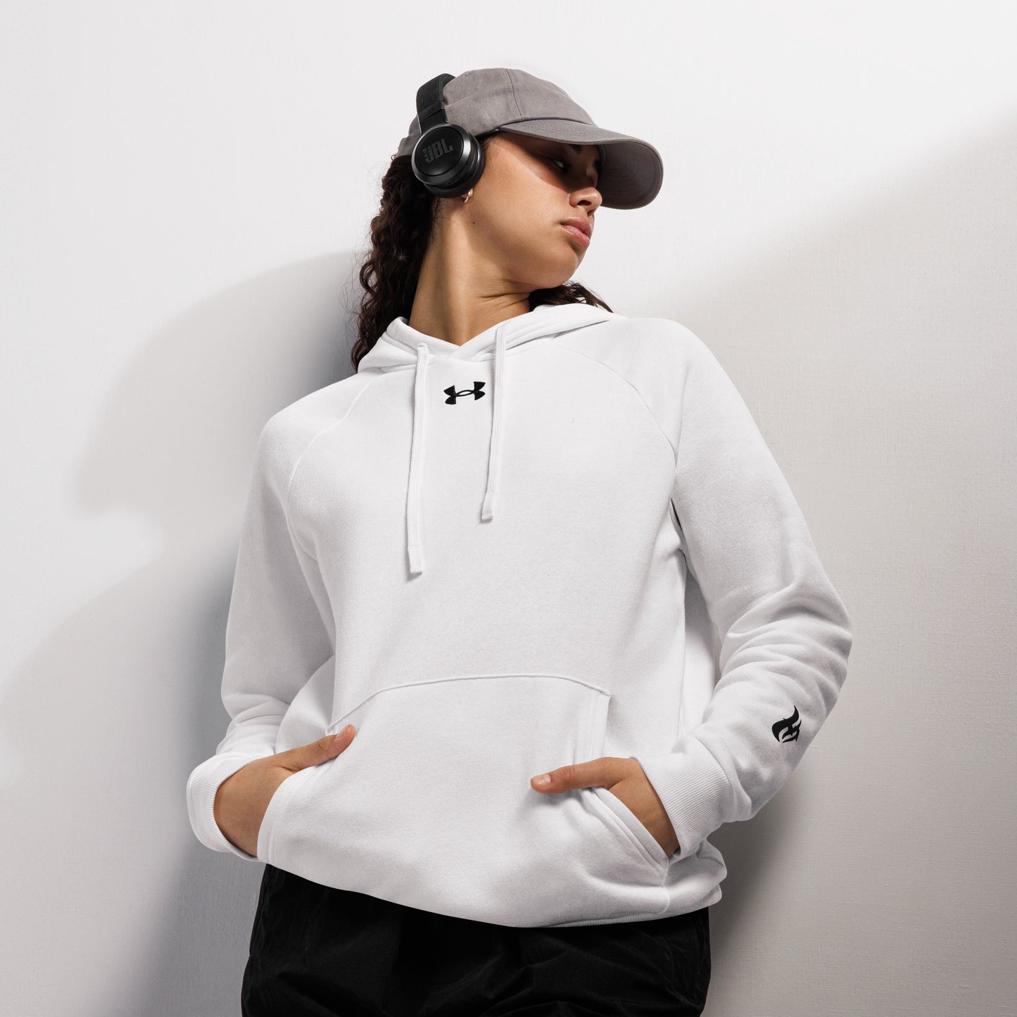 Woman wearing a HFT Under Armour® Hoodie with a relaxed fit, showcasing comfort and a subtle logo, perfect for casual or active wear WHITE