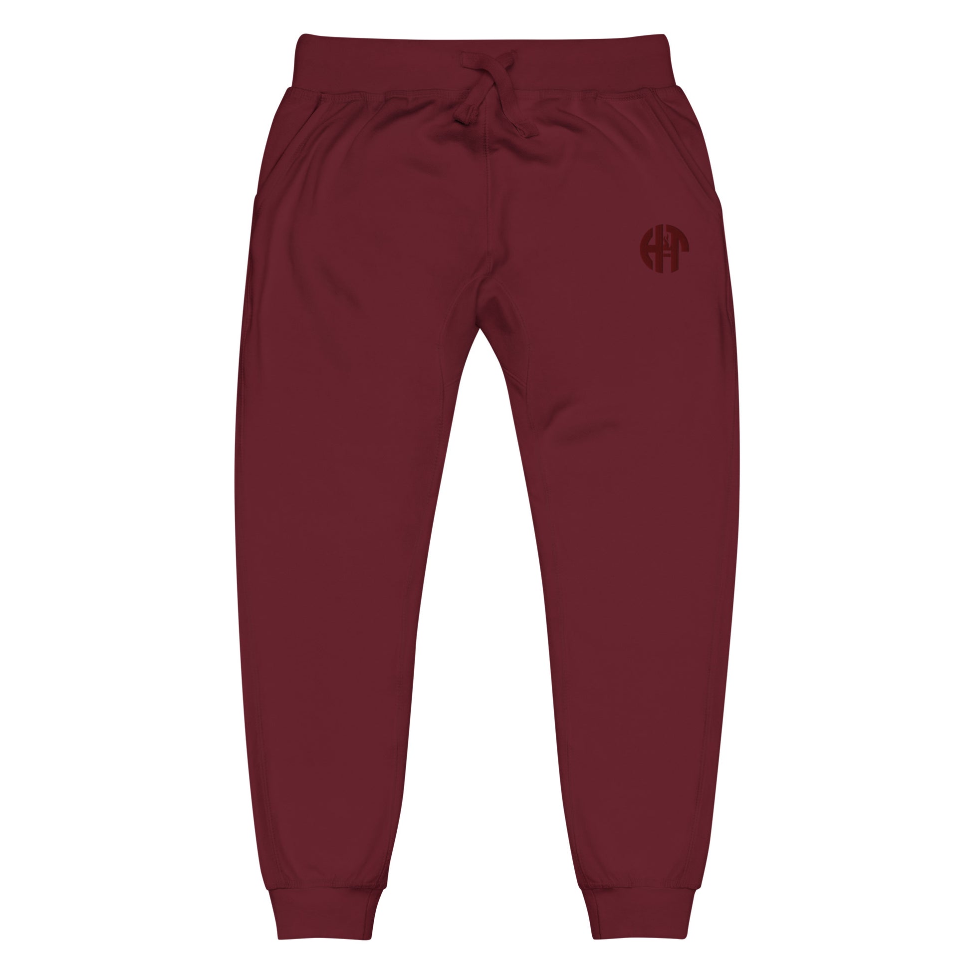 unisex fleece sweatpants with a comfortable fit, featuring an elastic waistband, elastic ankle cuffs, and a subtle black 'HFT' logo on the upper left thigh maroon front