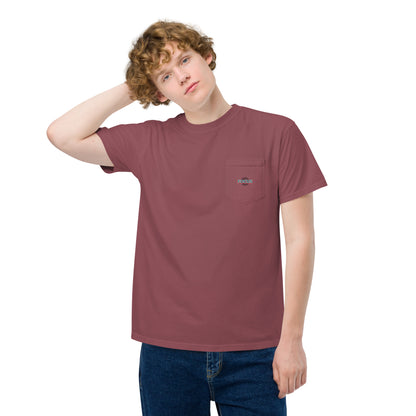 Person wearing the HFT Unisex Garment-Dyed Pocket T-shirt featuring a distinctive peace-sign hand graphic and the word 'p.e.a.c.e' printed on the back brick front