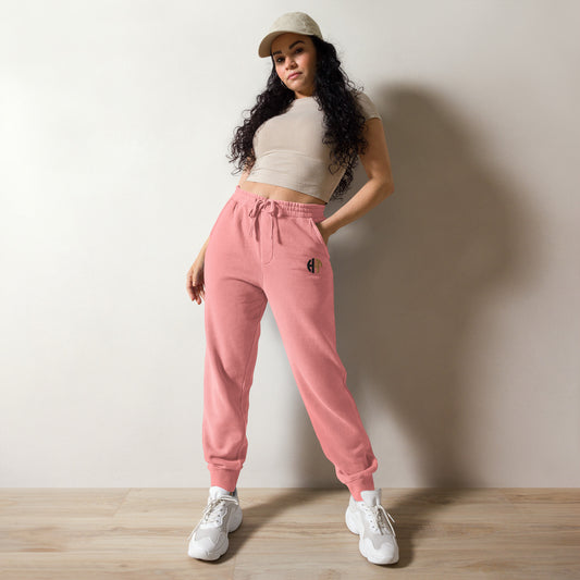 Unisex pigment-dyed sweatpants in a unique shade with front and back pockets and adjustable drawstrings pink front