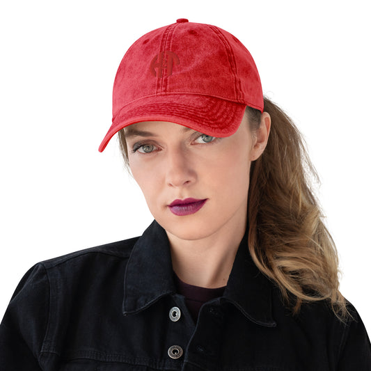 A baseball cap with a front view, featuring a embroidered logo HFT in the center. The hat has a classic six-panel design with a curved brim and an adjustable strap visible at the back red front