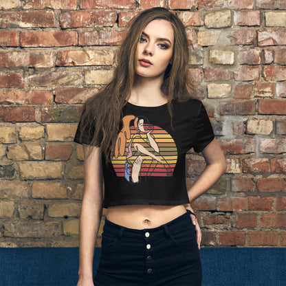 Black HFT Women's Crop Tee with a colorful, retro-inspired graphic print of a woman seated and wearing headphones, model  front