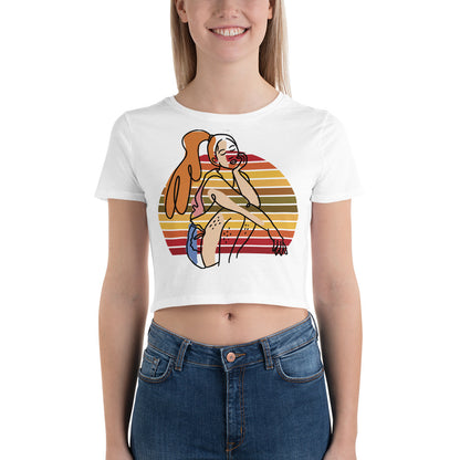 White HFT Women's Crop Tee with a colorful, retro-inspired graphic print of a woman seated and wearing headphones, model wear no face show